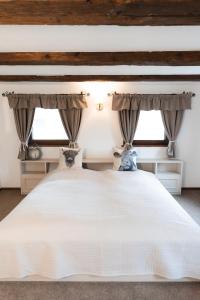 Postel nebo postele na pokoji v ubytování Ferienunterkunft Heimatfleckerl