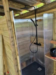 a shower in a sauna with a hose at Petit coin de Paradis in Saint-Michel-de-Lanès +35 photos