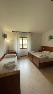 Postel nebo postele na pokoji v ubytování Albergo Miravalle