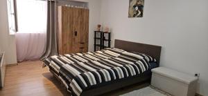 Postel nebo postele na pokoji v ubytování Apartman Zvijezda