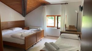 Postel nebo postele na pokoji v ubytování Albergo Miravalle