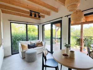 a living room with a couch and a table at Chalet Slapy in Slapy