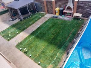a backyard with golf balls on the grass at Garsoniera in Vila Campus Mamaia Constanta in Constanţa