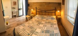 a bedroom with a large bed with a wooden headboard at Casale Degli Angeli in Vieste