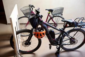 two bikes are parked next to each other at Casa da Charlie in Busca