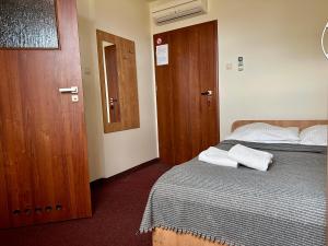 Postel nebo postele na pokoji v ubytování Hotel Paola