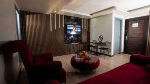 a living room with a couch and a table at Sara Suit in Istanbul