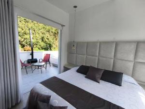 Postel nebo postele na pokoji v ubytování Mirador samsara Penthouse con Jacuzzi al aire libre,piso completo