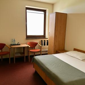 Postel nebo postele na pokoji v ubytování Hotel Paola