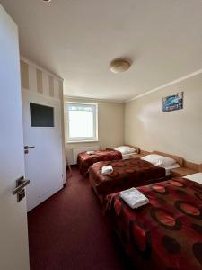 Postel nebo postele na pokoji v ubytování Hotel Paola