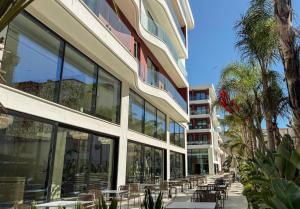 a building with tables and chairs in front of it at Savotel in Golem