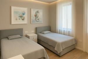 เตียงในห้องที่ Turquoise Poolside Thymus Resort 34-1