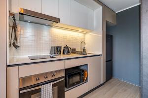 A cozinha ou kitchenette de Corazón Stgo Estilo Puro