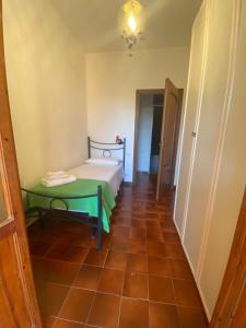 a room with a bed and a green table at Villa Franca in Capoterra +33 photos