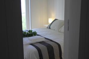 Ein Bett oder Betten in einem Zimmer der Unterkunft Moinhos da Corga