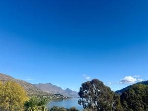 a view of a lake with mountains in the background at Luxury Lakeside Landing in Queenstown