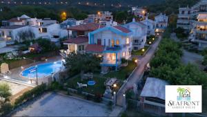 an aerial view of a house with a swimming pool at SeafrontGardenHouse Villa in Iraklitsa
