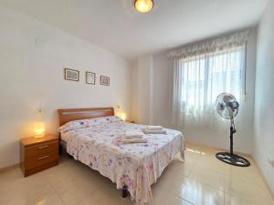 Postel nebo postele na pokoji v ubytování acapulco 3 frontal