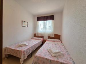 Postel nebo postele na pokoji v ubytování acapulco 3 frontal + 18 fotografií