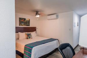 Voodi või voodid majutusasutuse Drift Inn San Pedro toas