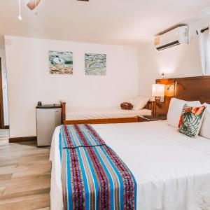 Voodi või voodid majutusasutuse Drift Inn San Pedro toas