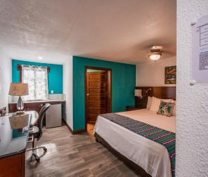 Voodi või voodid majutusasutuse Drift Inn San Pedro toas
