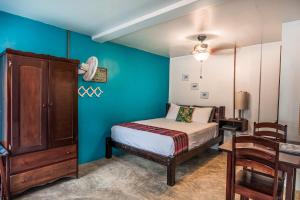 Voodi või voodid majutusasutuse Drift Inn San Pedro toas