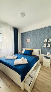 Rúm í herbergi á AquaBlue Jagodina