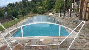a swimming pool with a cover around it at Casa Gelito in Espinareda de Vega