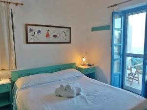 Katil atau katil-katil dalam bilik di Pericles Sea View House in Kohylou