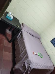 Ένα ή περισσότερα κρεβάτια σε δωμάτιο στο Kame-House Backpackers