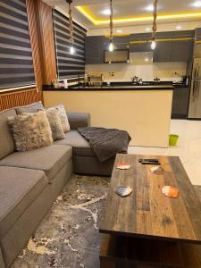 a living room with a couch and a coffee table at Beach Condo - 2 Mins from Ocean in Tangier +7 photos