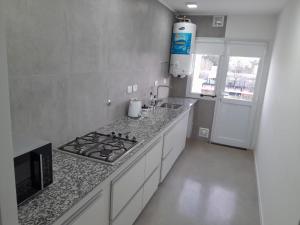Η κουζίνα ή μικρή κουζίνα στο Departamentos Felice