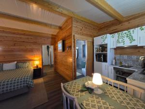 a bedroom with a bed and a table in a room at Rosegarden View in Velas