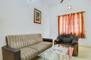Posezení v ubytování Super Hotel O Infosys Thoraipakkam