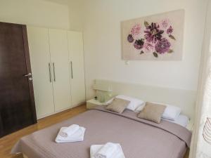 Posteľ alebo postele v izbe v ubytovaní Apartments Eddie