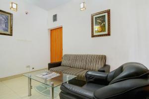 Posezení v ubytování Super Hotel O Infosys Thoraipakkam