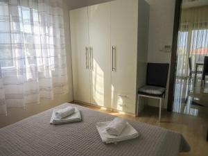 Posteľ alebo postele v izbe v ubytovaní Apartments Eddie