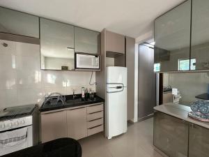 Η κουζίνα ή μικρή κουζίνα στο lençóis park residence