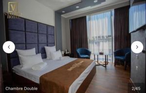 Postel nebo postele na pokoji v ubytování WIAGGO Hotel & Tours + 3 fotografie