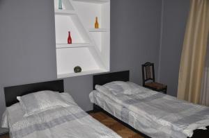 Кровать или кровати в номере Tin-Tina Guesthouse