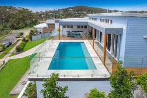 an aerial view of a house with a swimming pool at The Lookout in Corlette