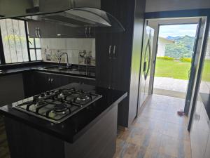 Kuchyň nebo kuchyňský kout v ubytování Finca Villa Claudia, La Mesa, Cundinamarca