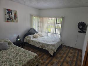 Postel nebo postele na pokoji v ubytování Finca Villa Claudia, La Mesa, Cundinamarca