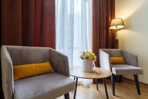 Posezení v ubytování Corona Hotel & Apartments