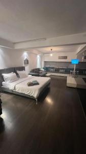a bedroom with a large bed in a room at Loft for 4 to the center of Thessaloniki in Thessaloniki