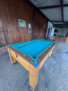 a pool table sitting inside of a building at Pousada Recanto Das Gerais in Carmo do Rio Claro