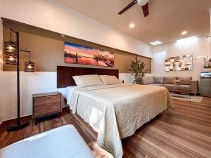 a bedroom with a large bed and a couch at Hotel Boutique Luciérnaga in Chiconcuac