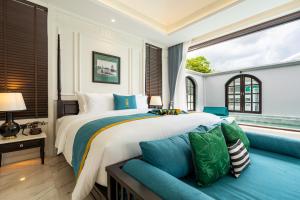 Un pat sau paturi într-o cameră la Siri Villa Chiang Mai +112 fotografii