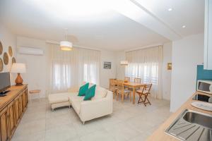 a living room with a couch and a table at Affitti Brevi Toscana - In Centro ad Orbetello in Orbetello